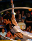 Dominique Major performing a coin spin in her German Wheel